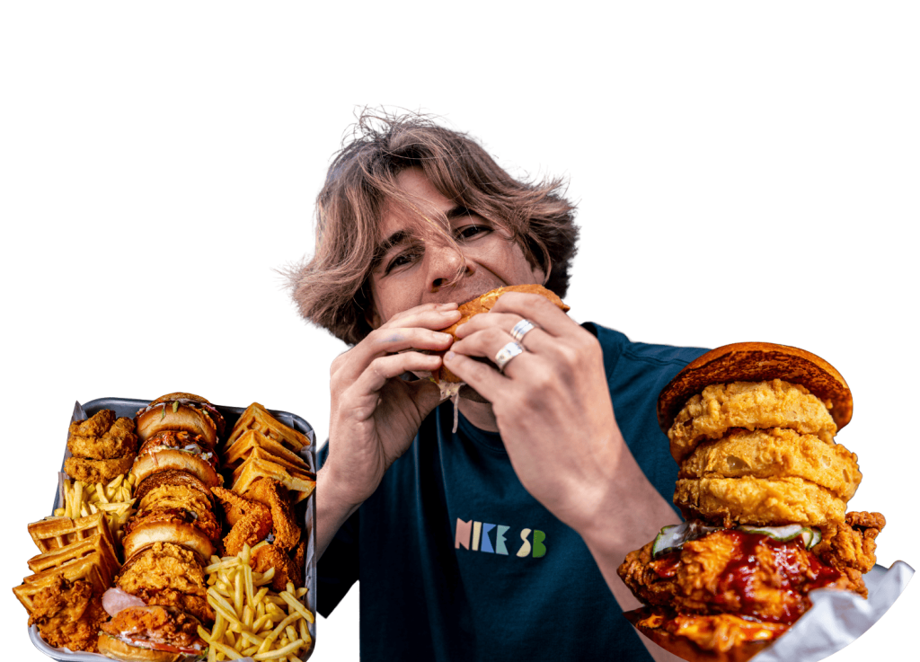 visual of man eating a burger